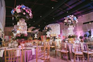 a banquet hall with tables and chairs with flowers at Hotel Gran David in Santiago +35 photos
