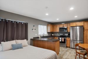 a kitchen with a bed and a table in a room at Big Spirit Resort in Spirit Lake