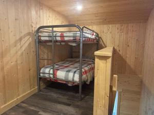 a room with two bunk beds in a cabin at Spa Lake & Miller Zoo - Oppy Shack in Frampton