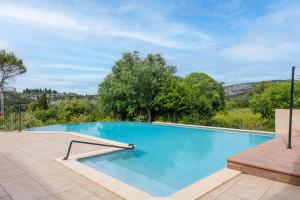 a swimming pool in a villa with a view at Résidence Château Saint Martin in Saint-Martin-dʼArdèche