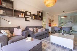 a living room with two couches and a table at Veras Home in La Tejita