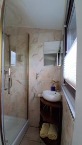 a bathroom with a shower and a sink at Gästehaus Fuchsröhre in Welcherath +124 photos