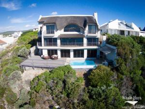 an aerial view of a house with a swimming pool at Whale Huys Luxury Oceanfront Eco Villa in Gansbaai