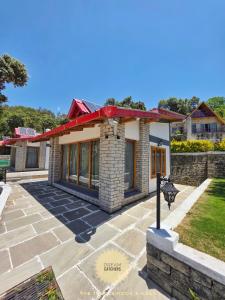 a house with a red roof at The Jungle Hook Binsar in Almora