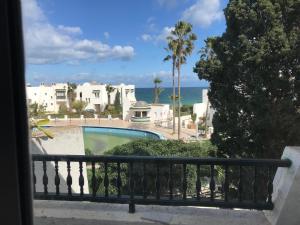 a view of the ocean from the balcony of a house at Vue superbe in Port El Kantaoui