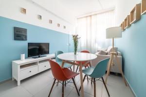 a dining room with a table and chairs at Maréa apartments - Sul mare 2 in Alba Adriatica