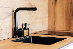 a kitchen counter with a sink and aaucet at Anna Luxury BELLA VISTA in Baošići +26 photos
