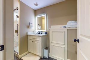 a bathroom with a white sink and a mirror at Nurse-Ready Studio Retreat! 2 Mi to Dtwn Holyoke in Holyoke