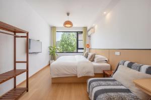 a bedroom with a bed and a ladder at 闲山民宿 CosyValley Inn in Hangzhou