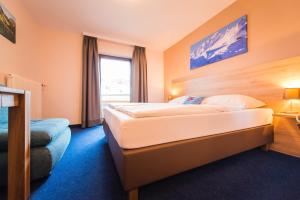 Posteľ alebo postele v izbe v ubytovaní Hotel Mosermandl