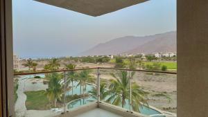 a balcony with a view of the desert and mountains at Century Stay by Bait Zain in As Sīfah
