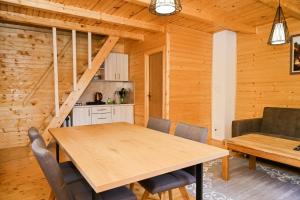a dining room with a table and chairs at Cottage Sunshine in Jajce