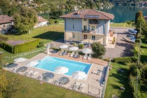 an aerial view of a house with a swimming pool at Recidence EMILIO in Ledro +13 photos