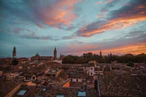a view of a city at sunset at Sina Maria Luigia in Parma