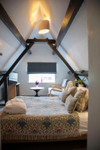 a bedroom with a large bed in a room at The Tollgate Inn in Bradford on Avon