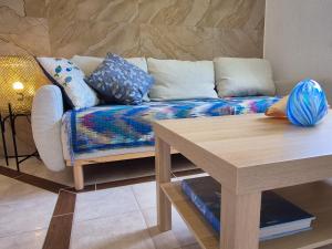 a living room with a couch and a wooden table at Casa Morlacca in Matulji