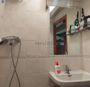a bathroom with a sink and a mirror at La casa di Fiore in Arcidosso