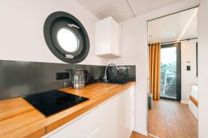 a kitchen with a counter top and a sink at Sea Lodge in Vieregge