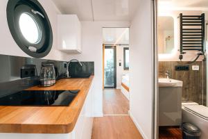 a kitchen with a counter top and a sink at Sea Lodge in Vieregge +22 photos