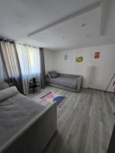 a living room with a bed and a couch at Ferienwohnung Monteurzimmer Mariens1 in Eppelborn