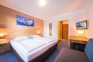 Posteľ alebo postele v izbe v ubytovaní Hotel Mosermandl