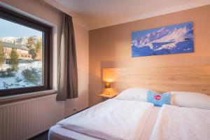 Posteľ alebo postele v izbe v ubytovaní Hotel Mosermandl