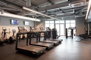 a gym with rows of tread machines in a room at Old Course Hotel St Andrews in St. Andrews