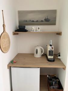 a kitchen with a counter top with a coffee maker on it at L'Intermezzo in Venzone