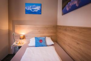 Posteľ alebo postele v izbe v ubytovaní Hotel Mosermandl