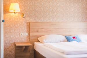 Posteľ alebo postele v izbe v ubytovaní Hotel Mosermandl