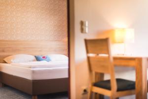 Posteľ alebo postele v izbe v ubytovaní Hotel Mosermandl