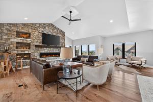 a living room with a couch and a fireplace at 238 Night Hawk Home in Granby