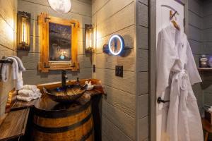 a bathroom with a barrel sink and a mirror at "Squirrels Gone Wild" Luxury Treehouse Adventure Near Dollywood & Pigeon Forge in Sevierville +34 photos