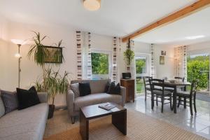 a living room with a couch and a table at Ferienwohnungen Knodel in Sachsenheim