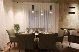 a dining room with a table and chairs at Montéa Villa in Brezovica
