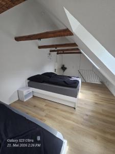 a bedroom with a bed and a staircase at Schneiders Apartment Style House in Trunkelsberg