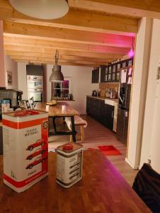 a kitchen with a pizza box and a table at B&B RingLodge in Kelberg