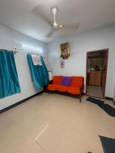 a room with a couch in a room at Explore Inn T-Nagar in Chennai