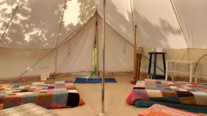 a tent with two beds inside of it at La mesange in Vaylats