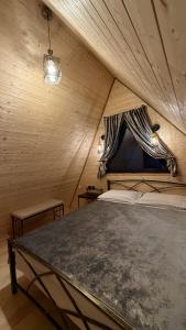 a bedroom with a large bed in a tent at Golden Star Cottage in Kazbegi