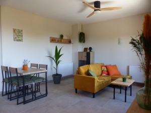 a living room with a couch and a table at Casa Nuestra Roca in Vélez-Rubio
