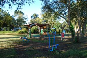 a park with a playground with a swing at VVF Labenne - Océan in Labenne