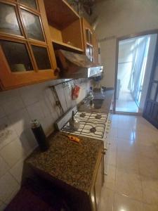 a kitchen with a stove and a counter top at Casa tranquila y segura in Santa Fe