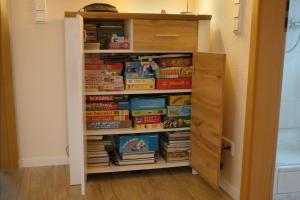 a book shelf filled with books in a room at FeWo im Lippischen Bergland in Kalletal +40 photos