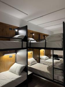 a group of bunk beds in a room at Generator Tashkent Hostel in Tashkent