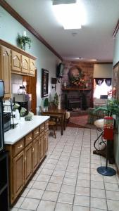 a kitchen and living room with a couch and a table at Hearthstone Inn in Lafayette