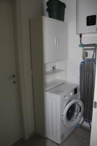 a washer and dryer in a small room at I Tre Ulivi 1 in Mozzate