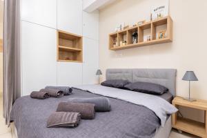 a bedroom with a bed with two pillows on it at Lavender Bay E2-1-studio apartment in Donji Morinj +23 photos