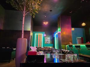 a restaurant with a table and a tree in a room at Hotel K-Tree Pyeongtaek in Pyeongtaek
