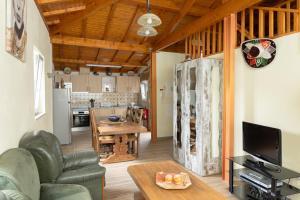 a living room with a couch and a table at Casa Fontenario in Vila Real